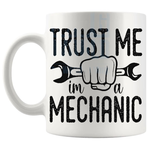 Trust Me I'm A Mechanic Mug funny garage gift shown with handle on the left