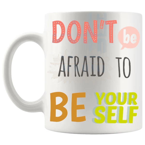 Don't Be Afraid To Be Yourself Mug with “Don't Be Afraid To Be Yourself” text design shown with handle on the left