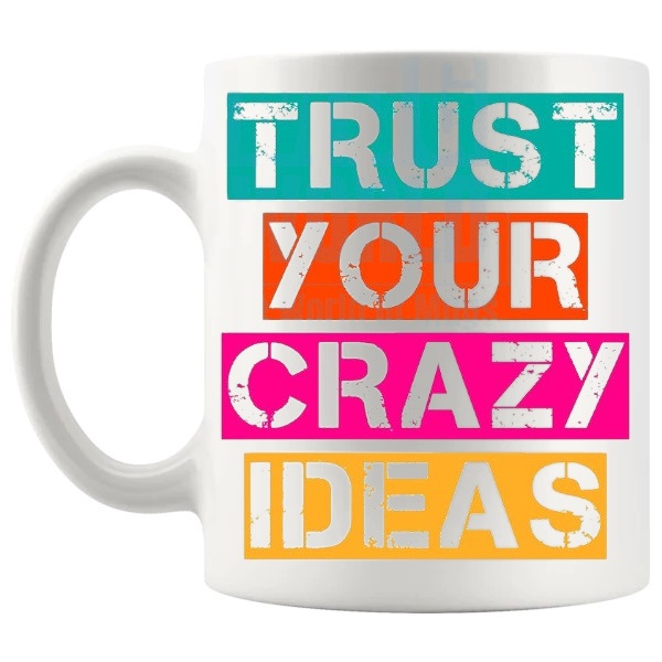 Trust Your Crazy Ideas Mug with “Trust Your Crazy Ideas” text design shown with handle on the left